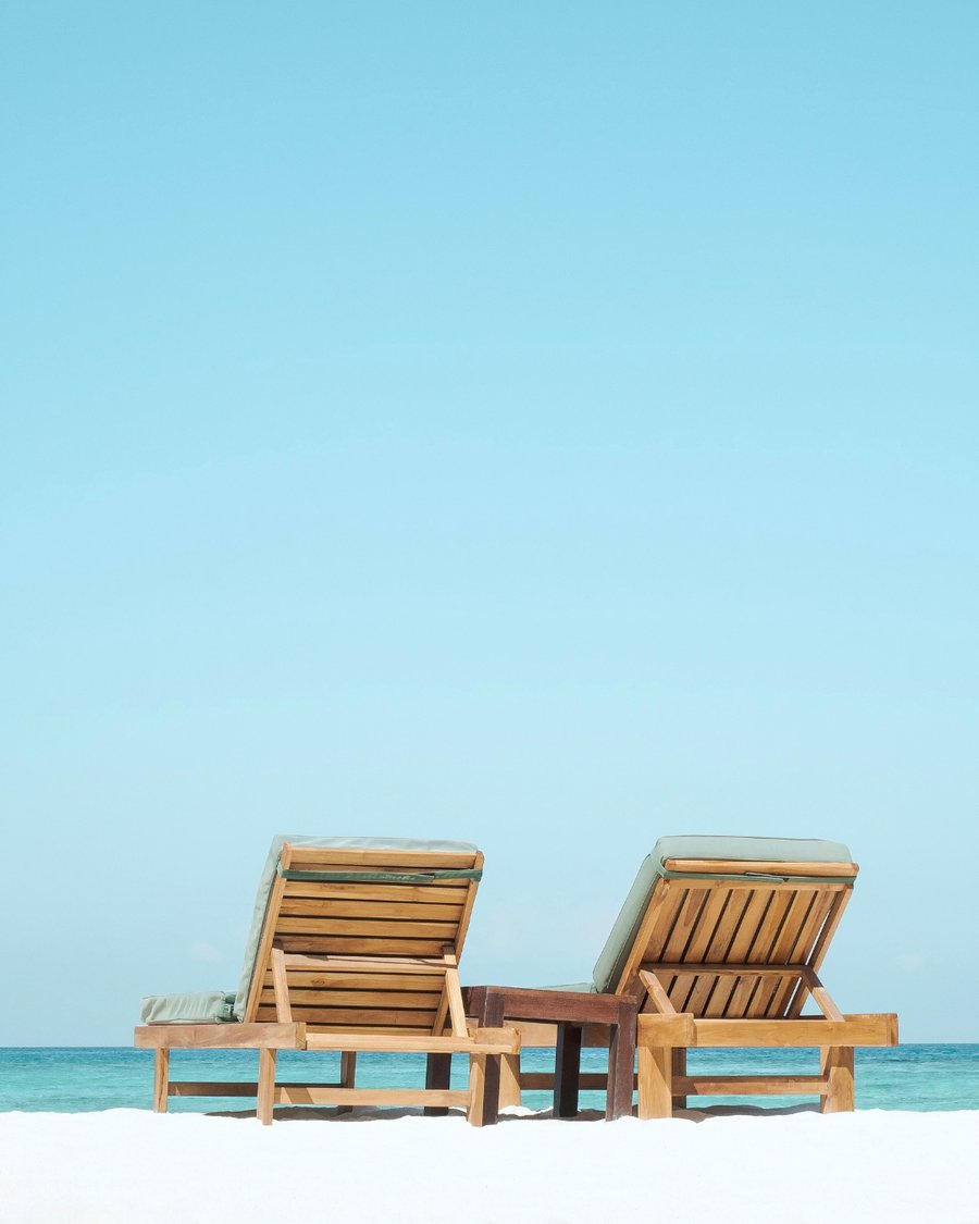 Resort beach loungers set up for a wedding welcome day